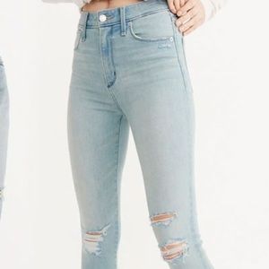 High waist light wash ripped jeans. Never Worn